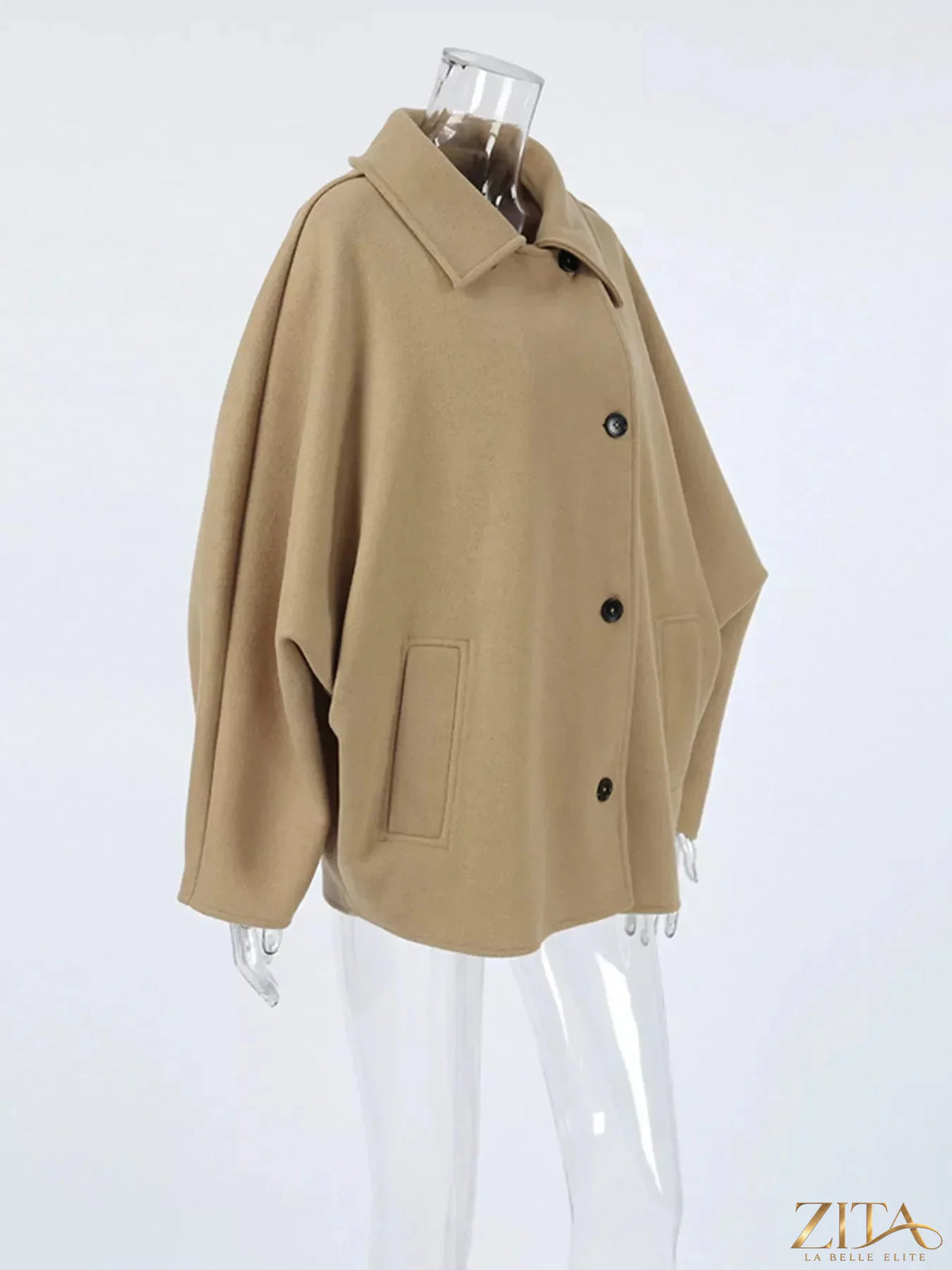 Zita La Belle Elite oversized coat with lapel collar and button-down front, shown in a stylish, neutral-colored fabric.