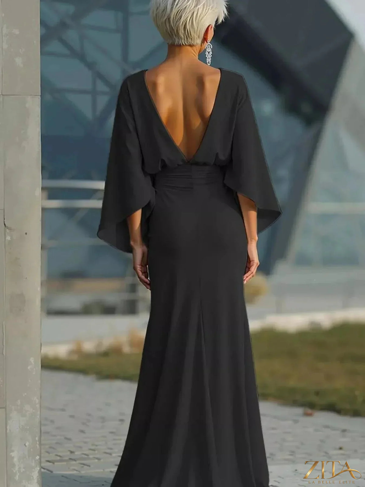 Zita La Belle Elite Batwing Sleeve Ruched Maxi Dress in black, flowing fabric with draped sleeves and ruched waist detail.