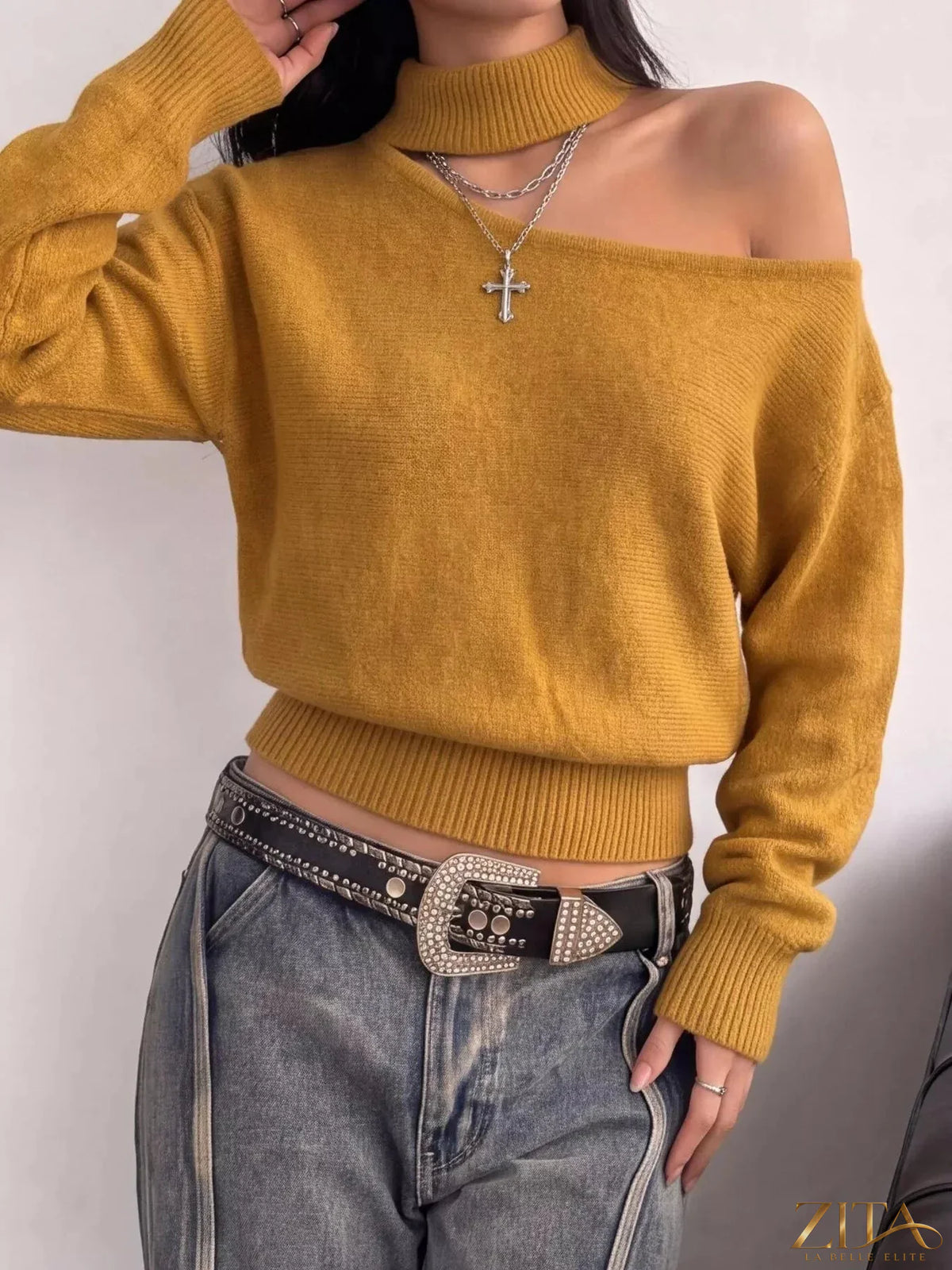 Cold-shoulder dropped shoulder sweater by Trendsi, in soft knit fabric with relaxed fit and stylish cut-out shoulder design.