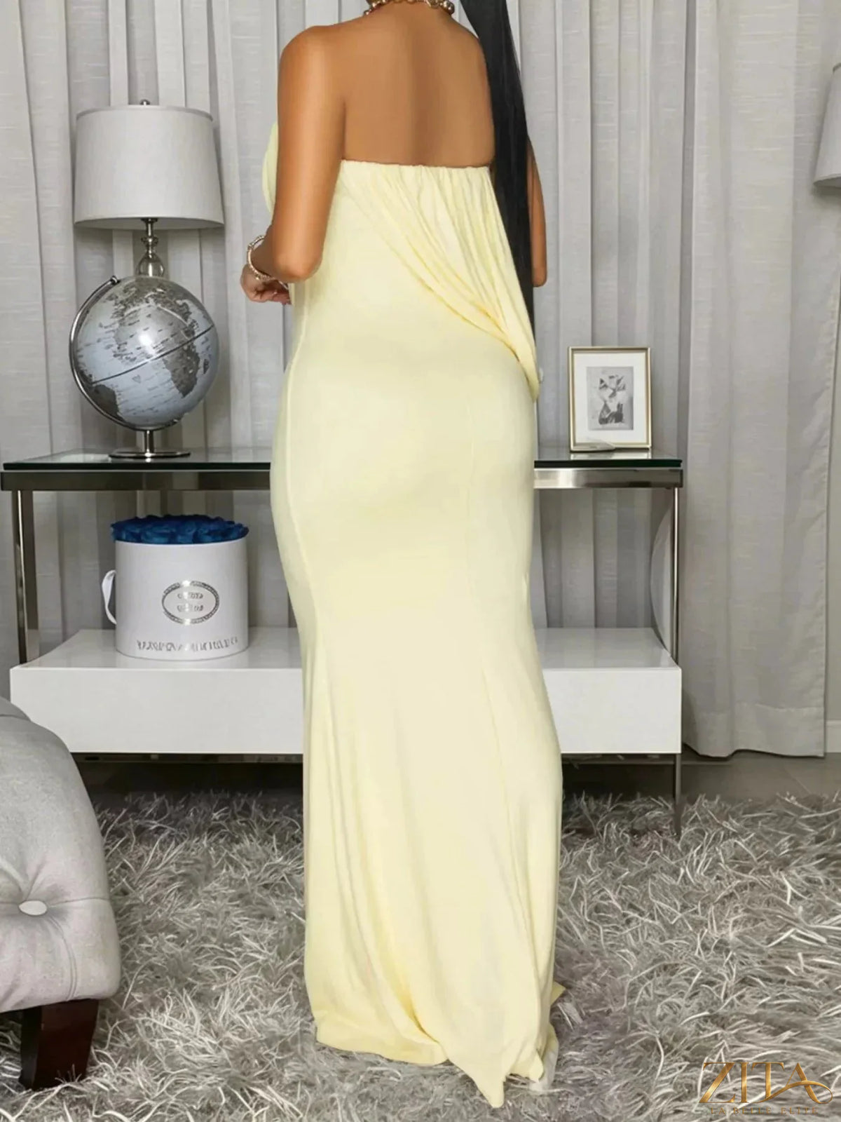 Strapless draped maxi dress by Trendsi featuring flowing fabric and elegant design, perfect for formal or summer occasions.
