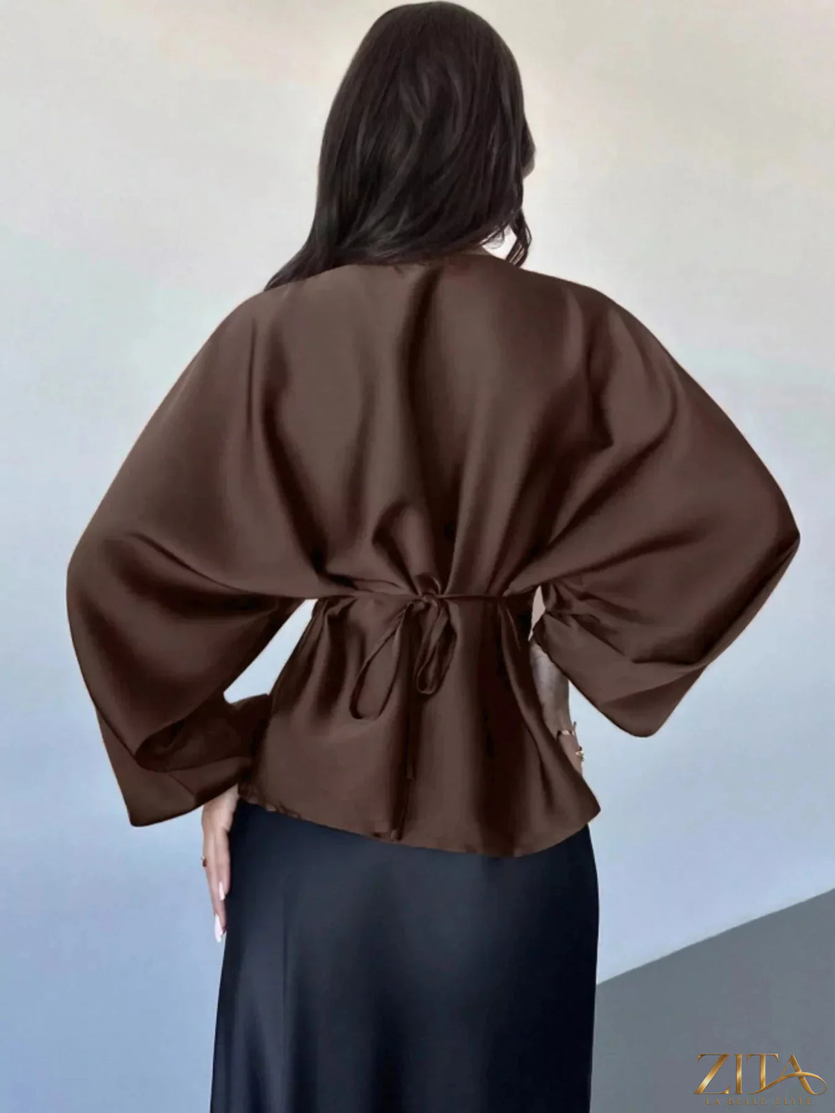 Zita La Belle Elite back tie long sleeve blouse featuring a fitted design and stylish neckline, shown on a model.
