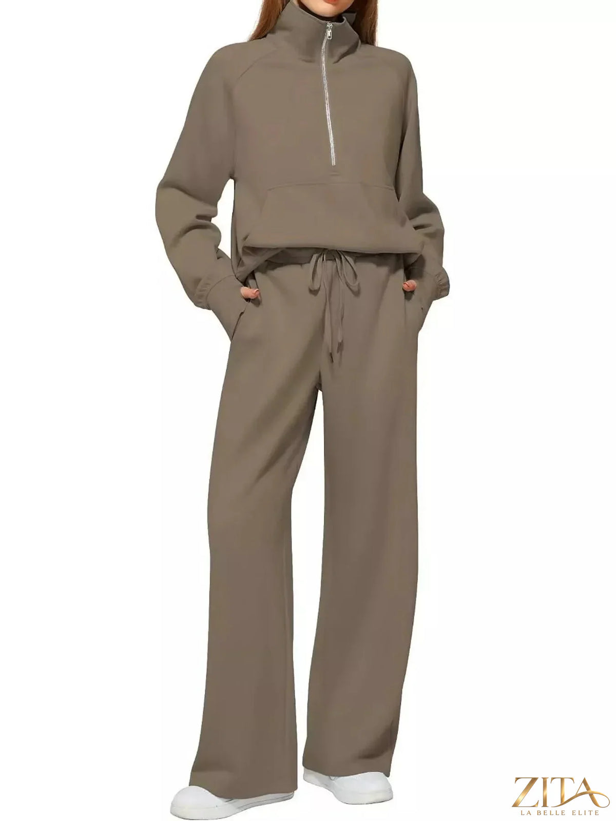 Zita La Belle Elite half-zip sweatshirt and wide-leg pants set in soft fabric, displayed on a hanger in neutral tones.