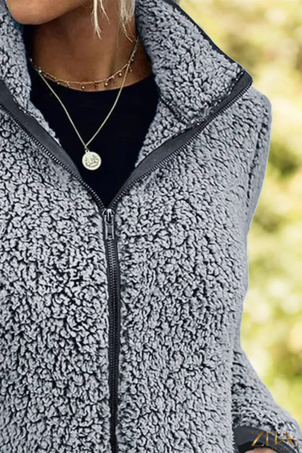 Trendsi pocketed zip-up turtleneck jacket featuring a high collar and front pockets, made of soft, cozy fabric.