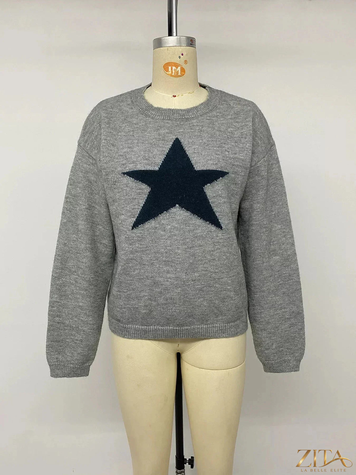 Star-patterned dropped shoulder sweater by Zita La Belle Elite, featuring a cozy knit with star designs and relaxed fit.