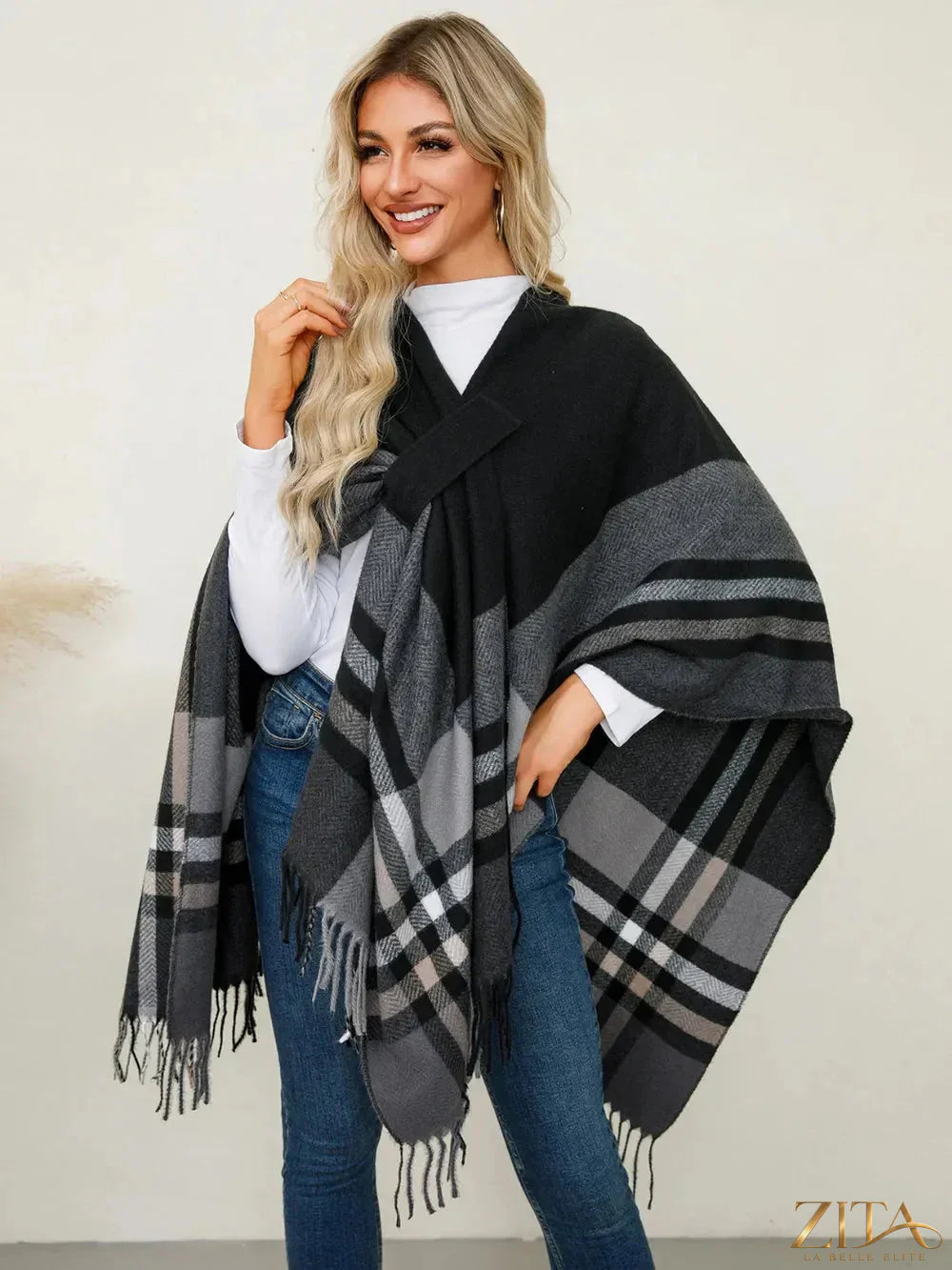 Trendsi fringe contrast plaid poncho with tassels, featuring a stylish tartan pattern and cozy, layered look for fall fashion.