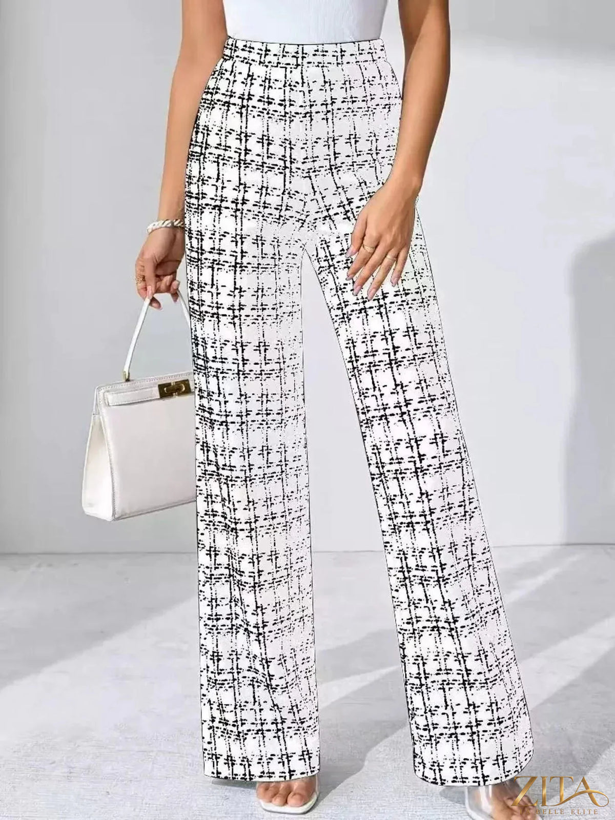 Zita La Belle Elite plaid wide-leg pants with high waist and relaxed fit, featuring a stylish tartan pattern and flowing silhouette.