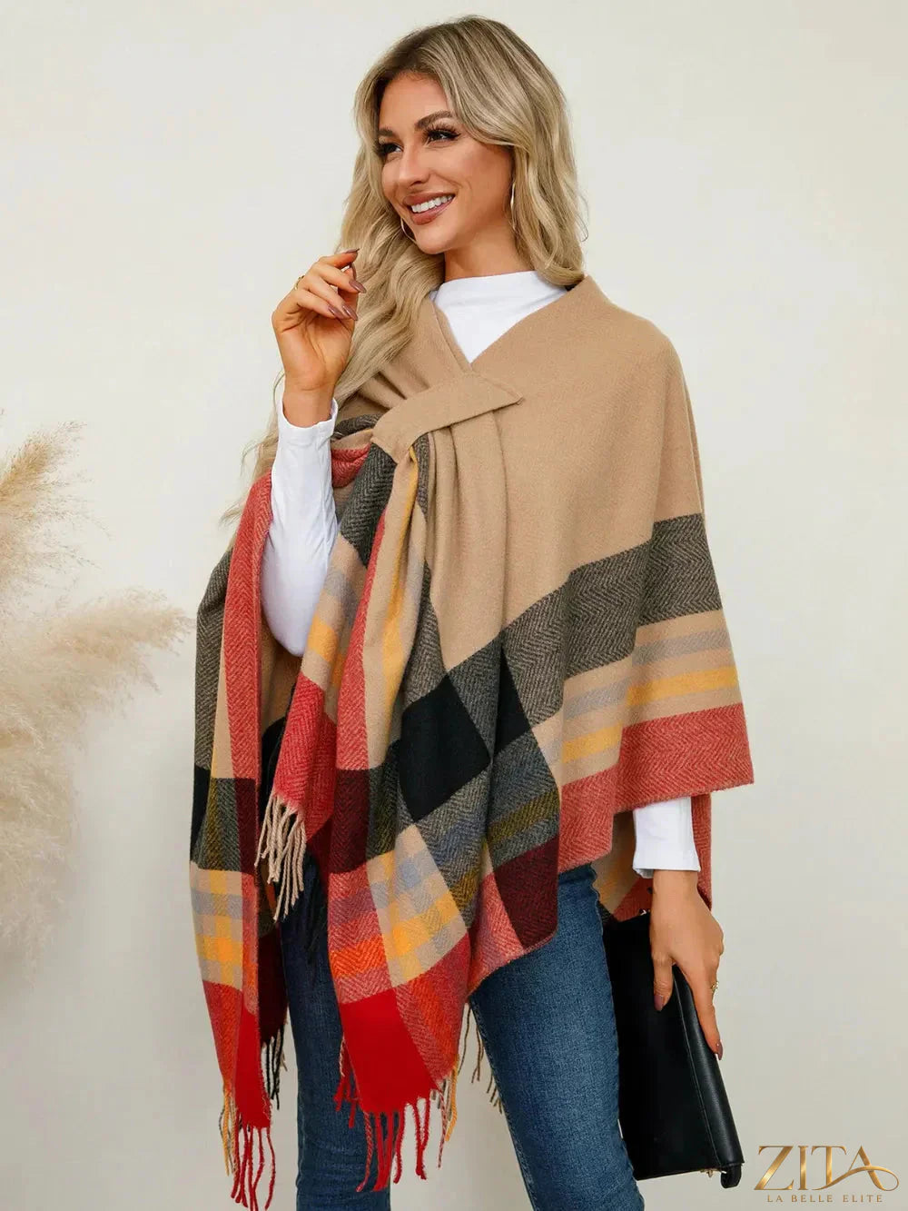 Trendsi fringe contrast plaid poncho with tassel details, stylish and cozy outerwear in a checkered pattern.