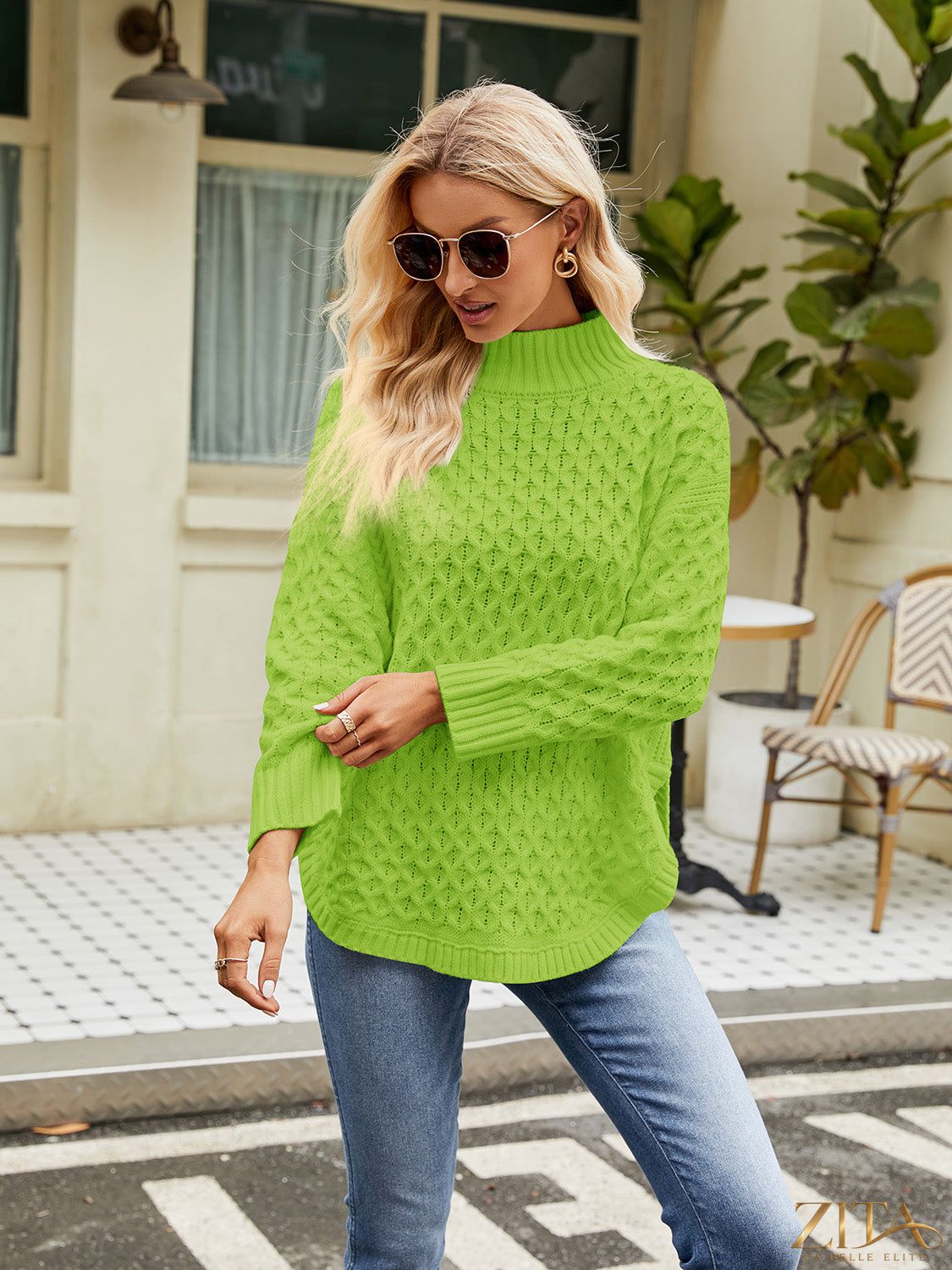 Zita La Belle Elite mock neck slit sweater in soft knit fabric, featuring a high neckline and side slits for a stylish look.
