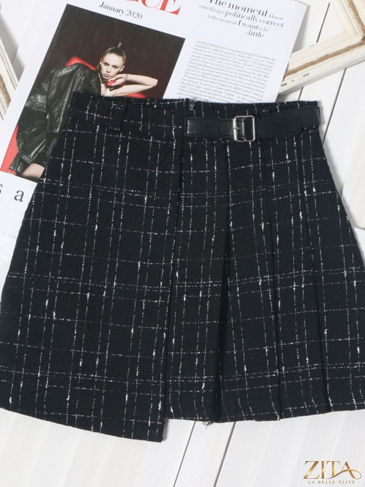 Zita La Belle Elite pleated plaid mini skirt showing a high-waisted design with a classic tartan pattern and pleated detailing.