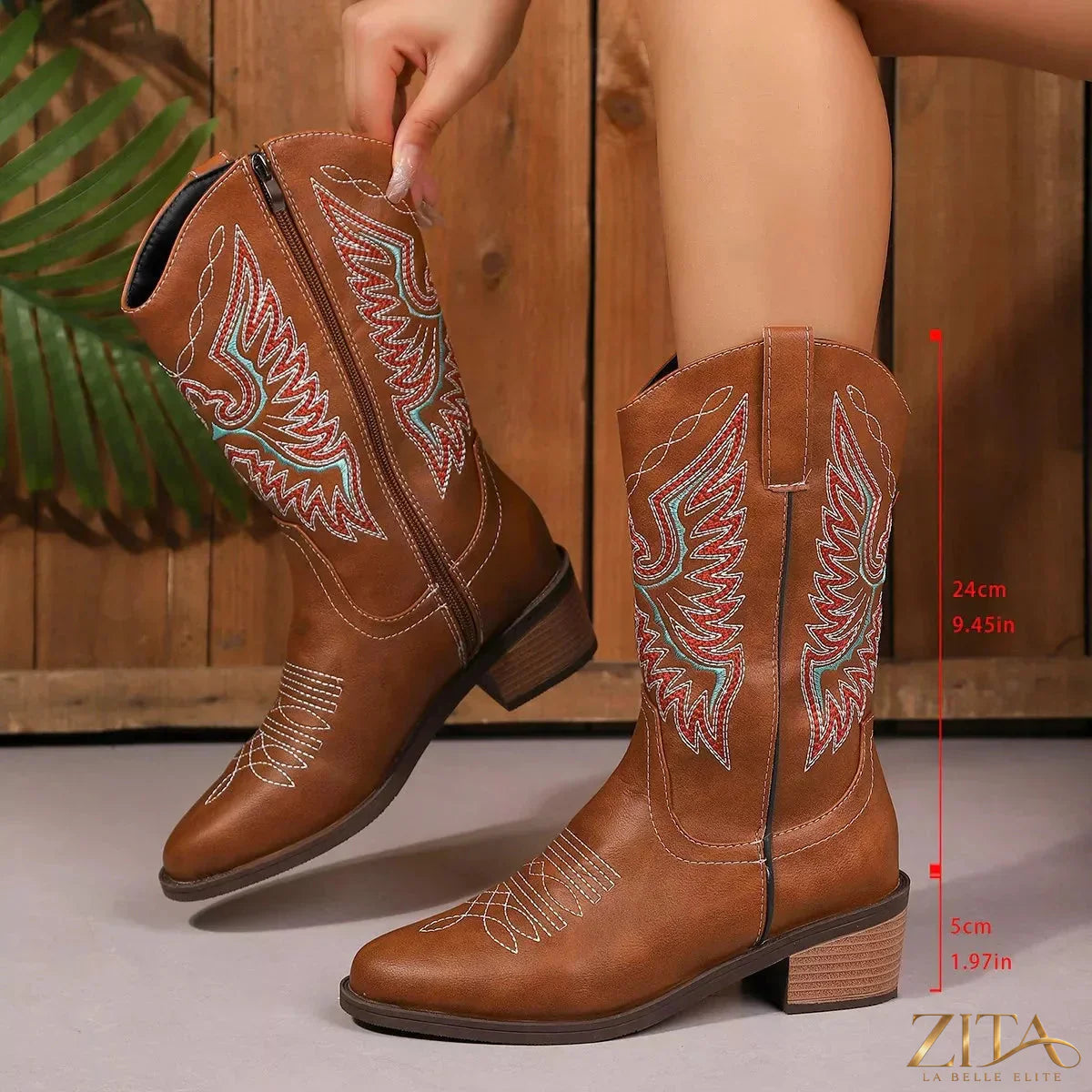 Embroidered Western cowboy boots with intricate floral embroidery and pointed toes, branded by Trendsi.