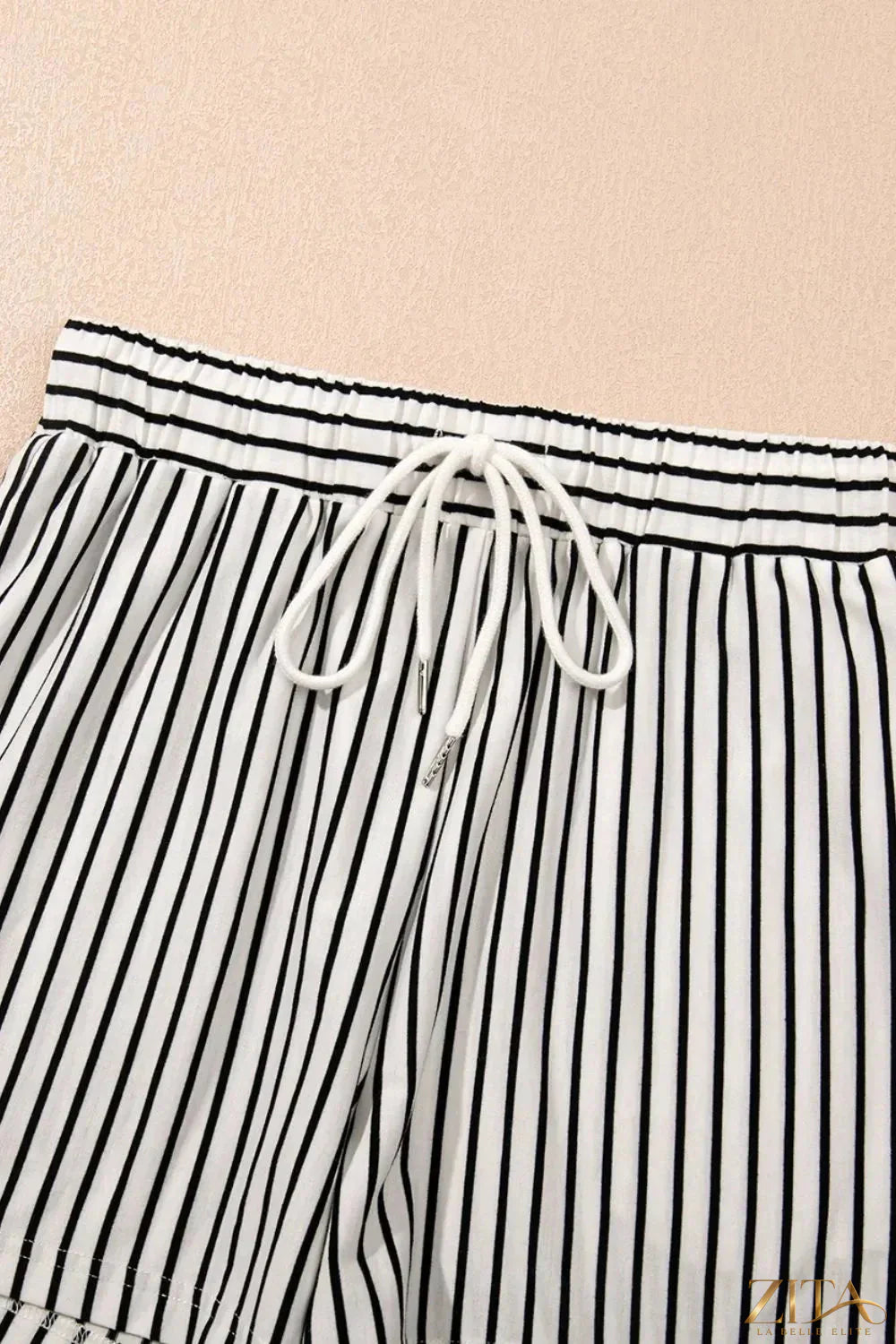 Stripe V-neck tee and casual shorts set by Trendsi, featuring a comfortable two-piece outfit with a relaxed fit and stylish design.