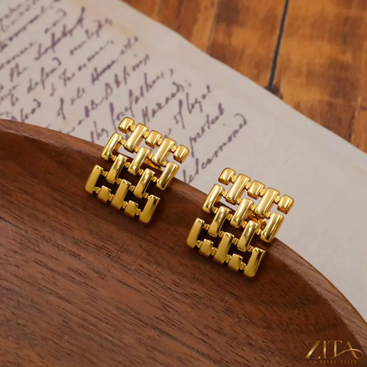 18K gold-plated geometric stud earrings by Zita La Belle Elite featuring modern, angular shapes on a clean background.