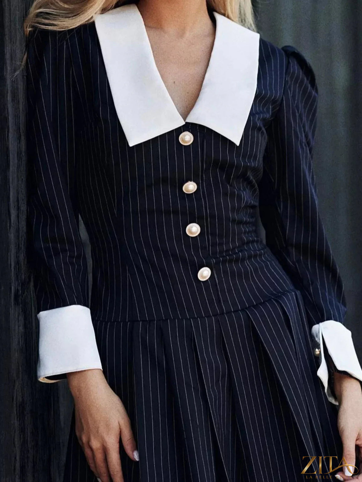 Zita La Belle Elite striped long-sleeve pleated mini dress with a fitted silhouette and stylish pattern, perfect for casual or dressy occasions.