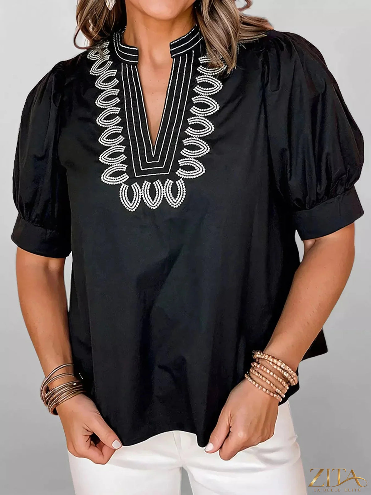 Zita La Belle Elite notched puff sleeve blouse in light fabric with gathered details and a stylish neckline.