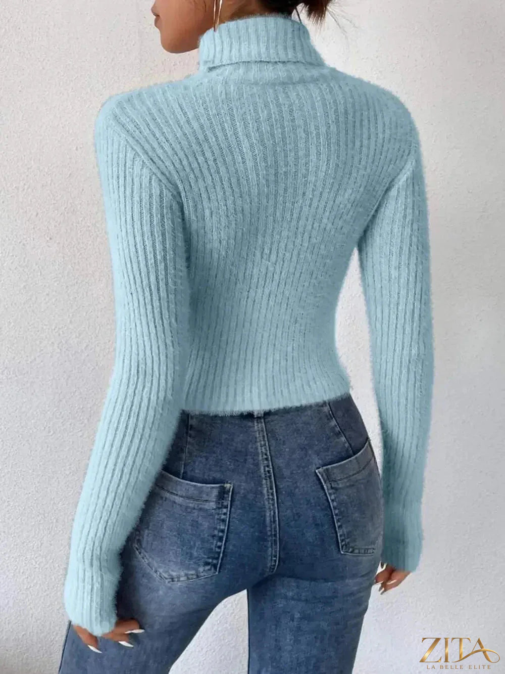 Ribbed turtleneck long sleeve sweater by Trendsi featuring a fitted design and cozy knit fabric in neutral color.
