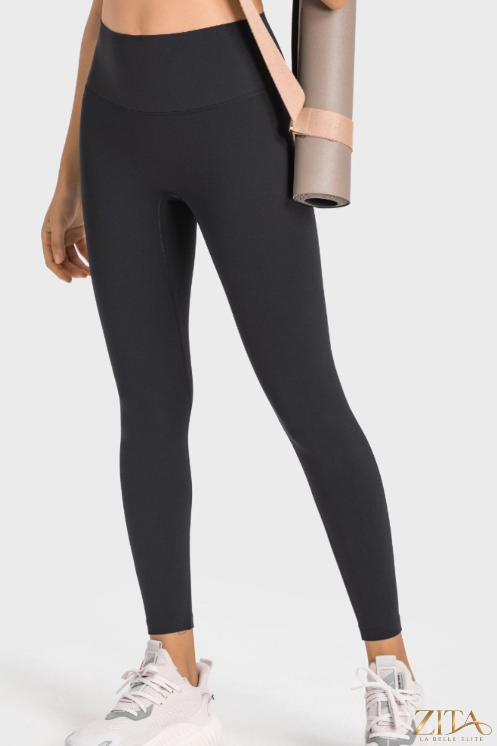 Millennia high-rise wide waistband yoga leggings from Trendsi, featuring a sleek fit and comfortable stretch fabric.