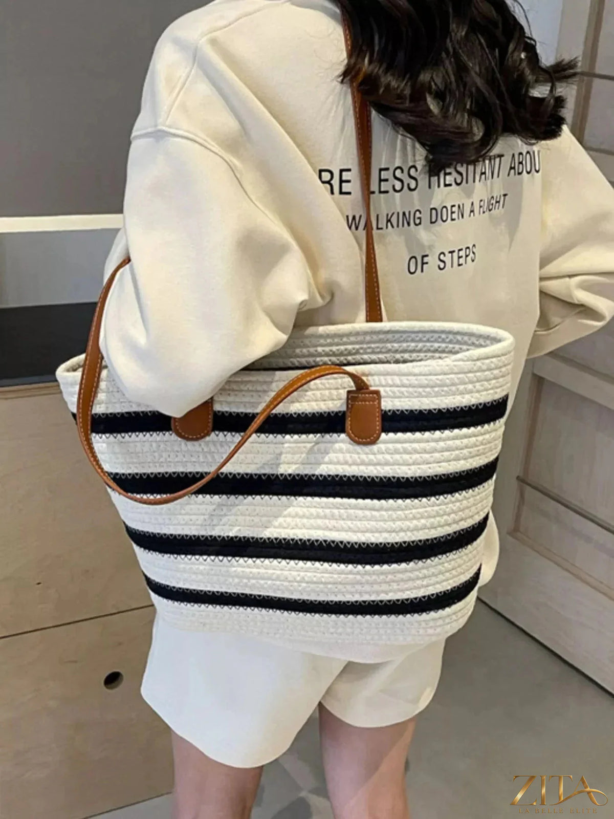 Zita La Belle Elite striped straw tote bag with woven handles and colorful striped pattern, perfect for summer outings.