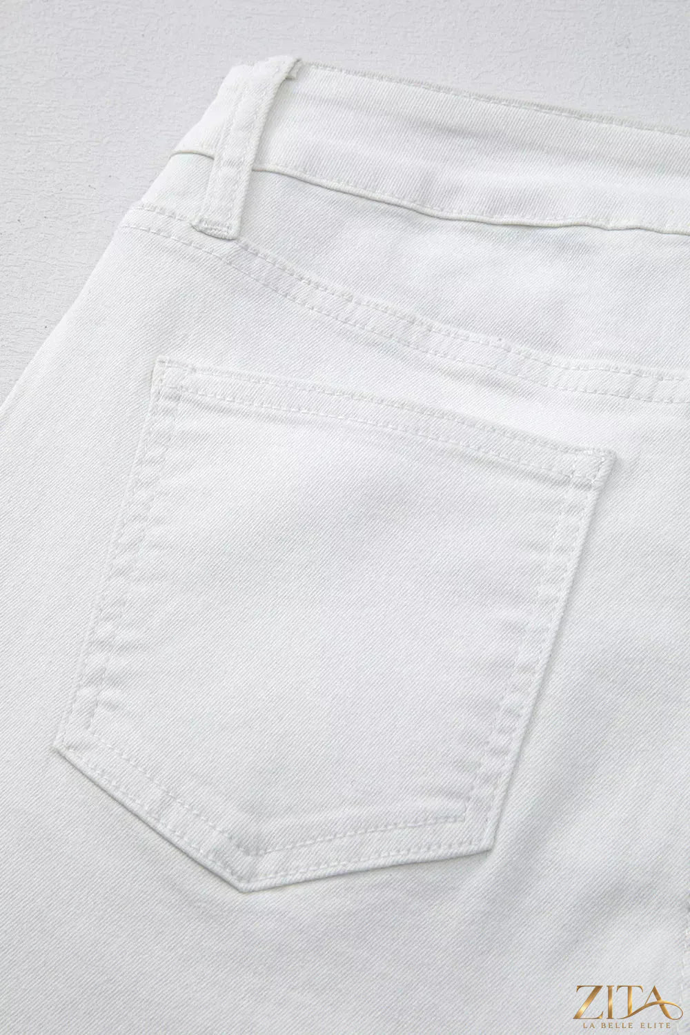 Zita La Belle Elite high-waisted straight leg jeans displayed on a hanger with a clean white background.