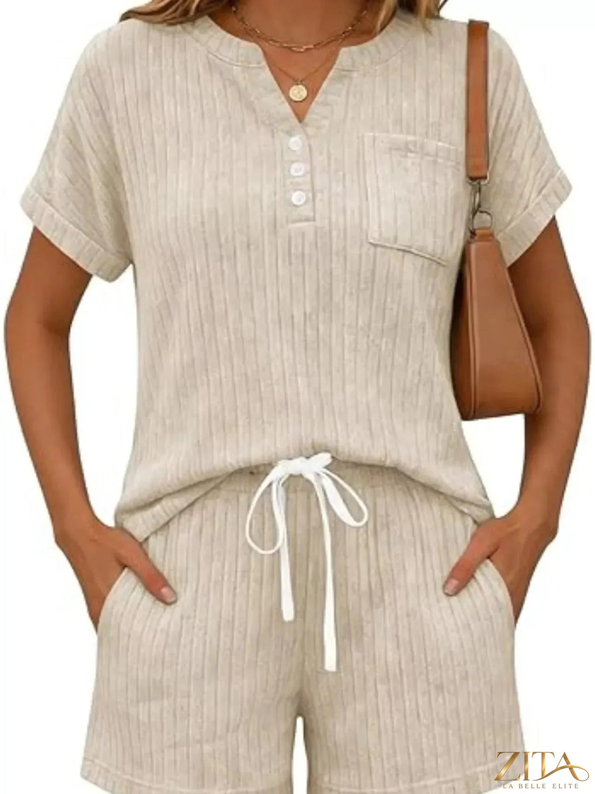 Casual ribbed knit tee and shorts set by Trendsi, featuring a comfortable, stylish matching top and bottom in a relaxed fit.