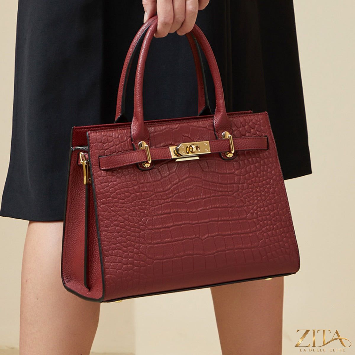 Crocodile-embossed leather top handle handbag by Zita La Belle Elite, featuring a structured design with gold-tone hardware.