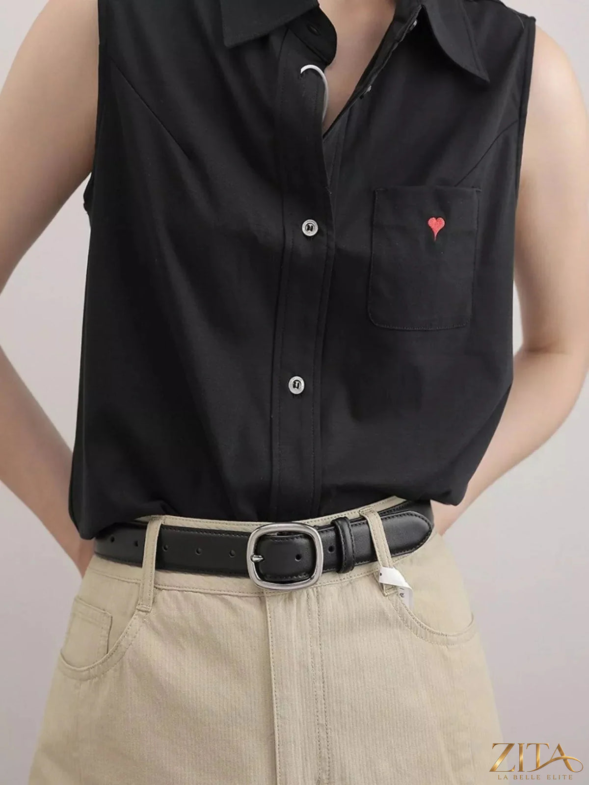 Leather belt with oval buckle from Trendsi, featuring smooth leather strap and polished metal buckle for casual or formal wear