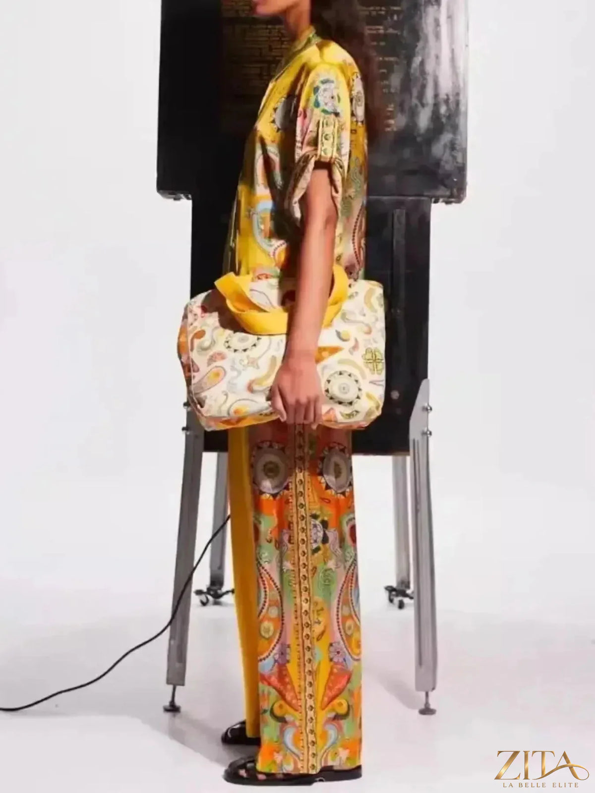 Zita La Belle Elite printed button-up shirt and matching pants set hanging on a rack, stylish and casual clothing ensemble