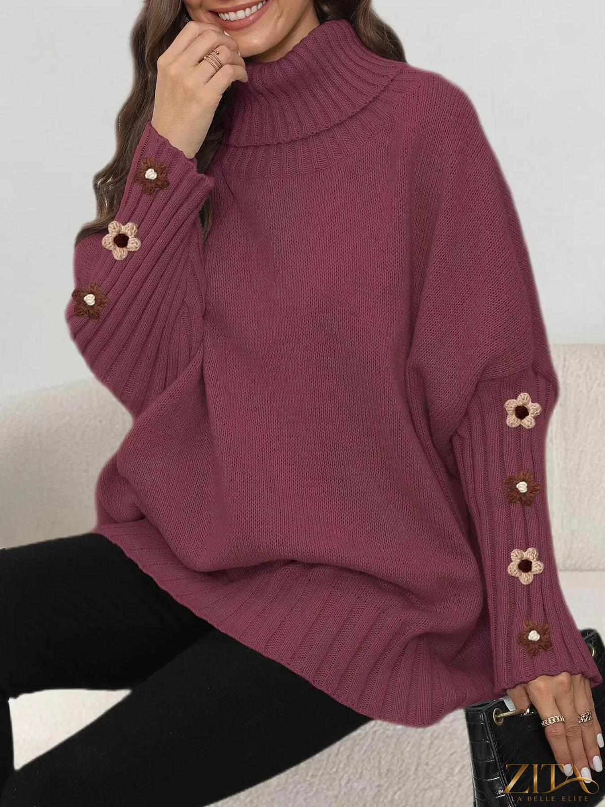 Zita La Belle Elite oversized turtleneck sweater with floral applique sleeves, cozy knit design and stylish floral detail.
