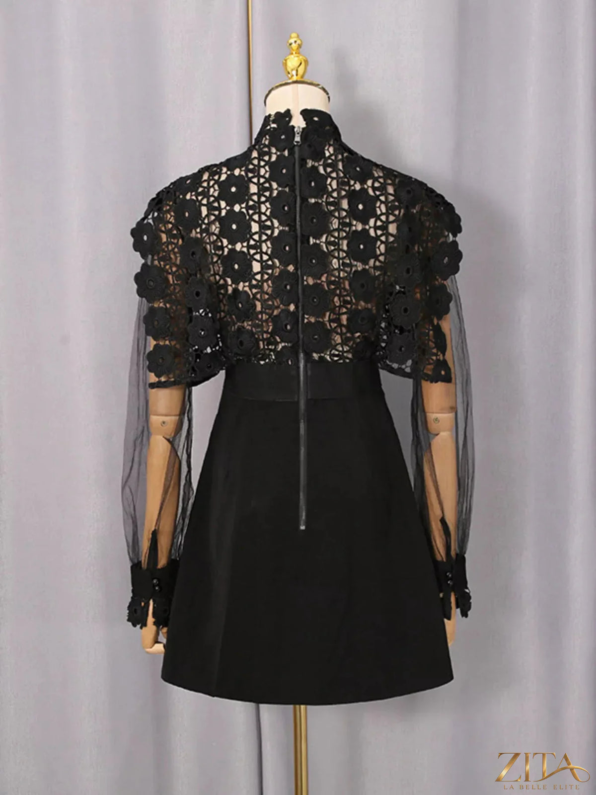 Lace sheer sleeve mini dress by Trendsi featuring delicate lace fabric and stylish sheer long sleeves on a model.