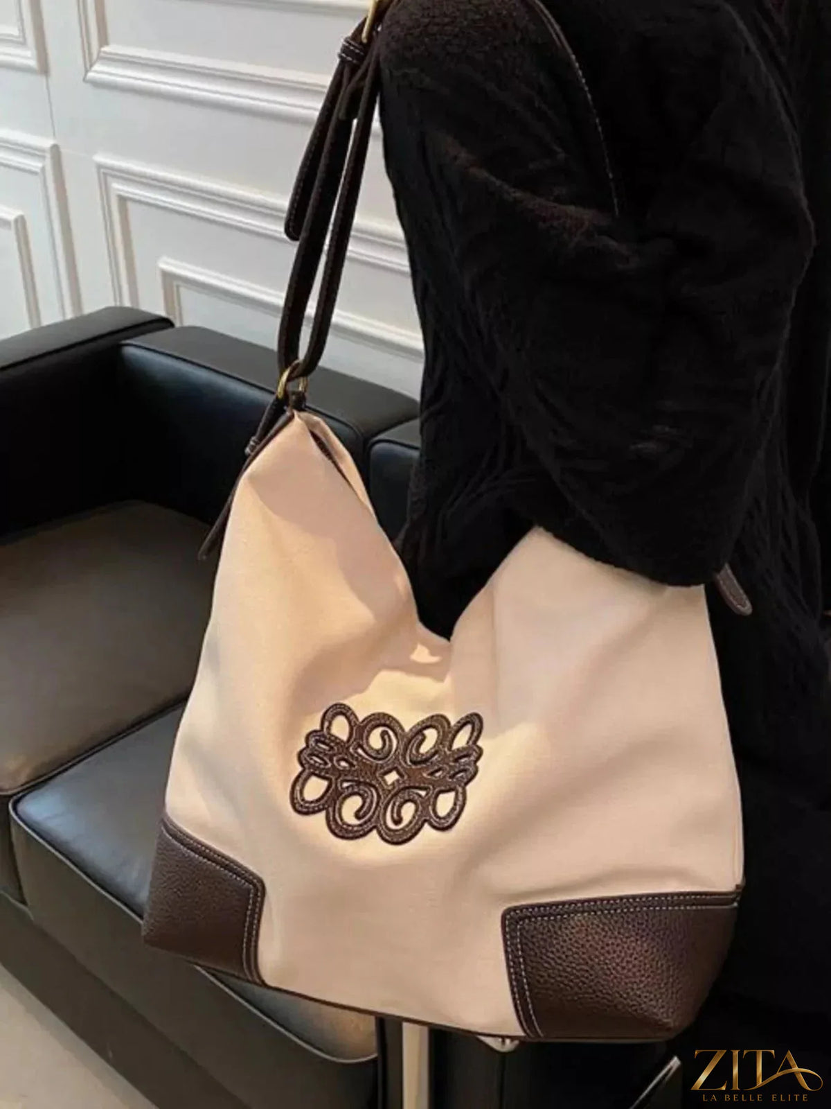 Embroidered canvas tote bag by Zita La Belle Elite with colorful floral embroidery and sturdy handles on a plain background.