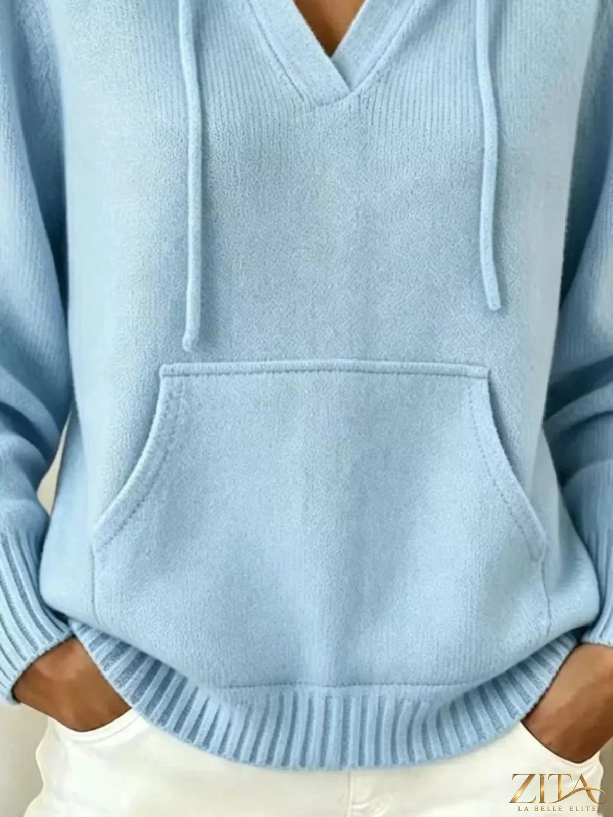 Gray kangaroo pocket hooded sweater by Trendsi, featuring a cozy hood, front pocket, and casual fit, shown on a model.