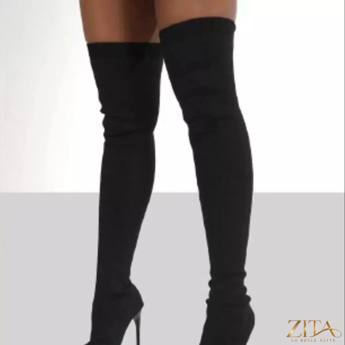 Point toe stiletto boots by Trendsi featuring sleek design, high heels, and stylish black leather exterior.