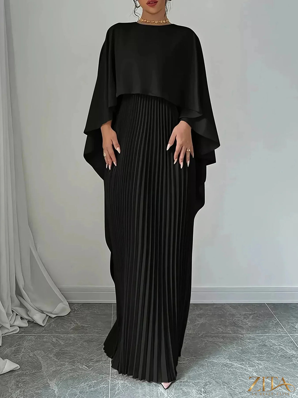 Elegant navy cape pleated maxi dress by Trendsi featuring flowing fabric and a stylish, sophisticated design.