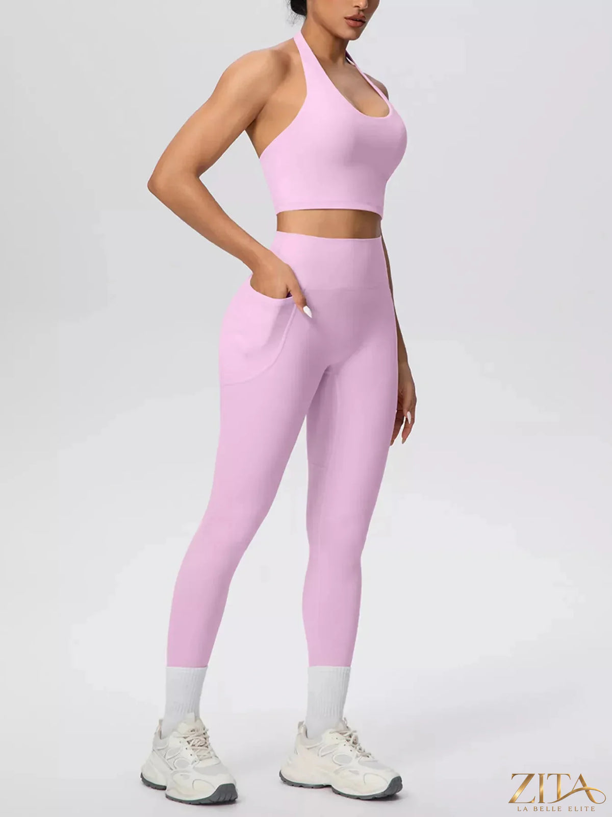 Zita La Belle Elite halter neck crop top and high-waisted leggings active set displayed on a model, stylish athletic wear for women.