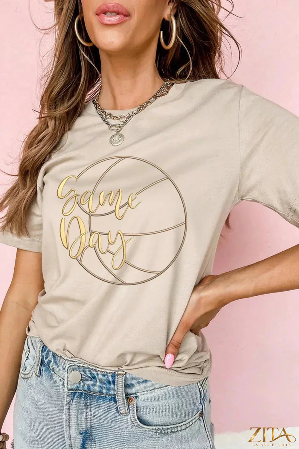 Basketball graphic T-shirt from Trendsi featuring game day design, soft cotton fabric, and casual fit perfect for sports fans.