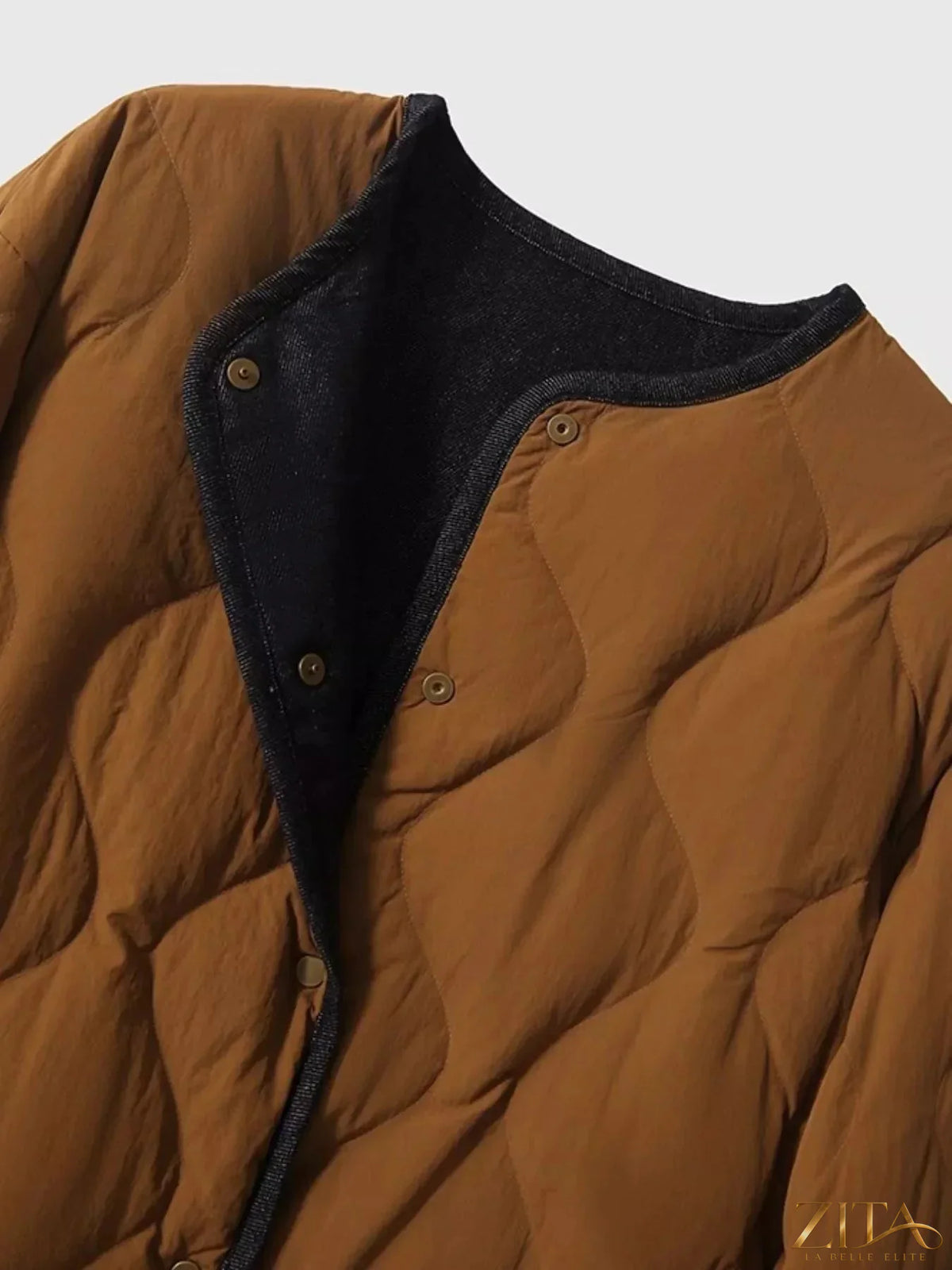 Diamond-quilted lightweight cropped reversible down jacket by Zita La Belle Elite, showing the quilted exterior and reversible design.