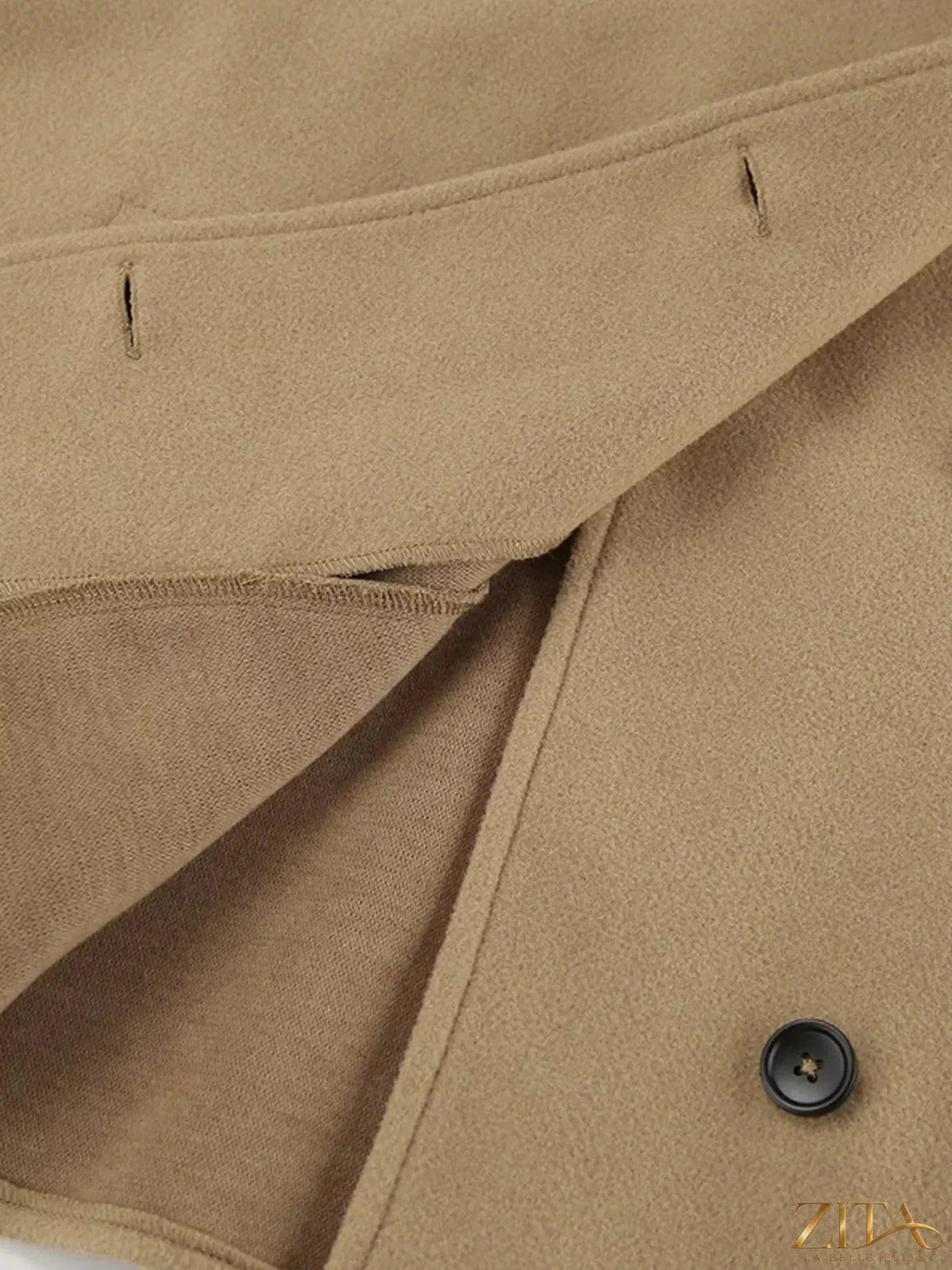 Zita La Belle Elite oversized lapel collar button-down coat hanging on a wooden hanger with a neutral background.