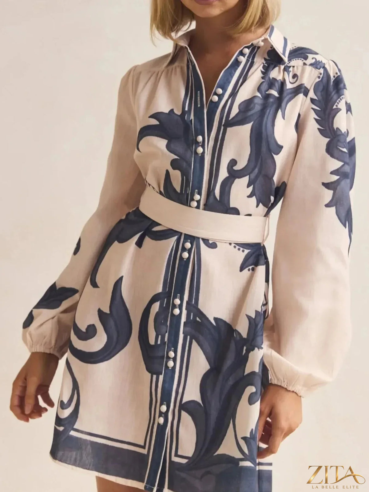 Printed long sleeve shirt dress from Trendsi featuring a casual, comfortable design with a button-up front and collar detail.
