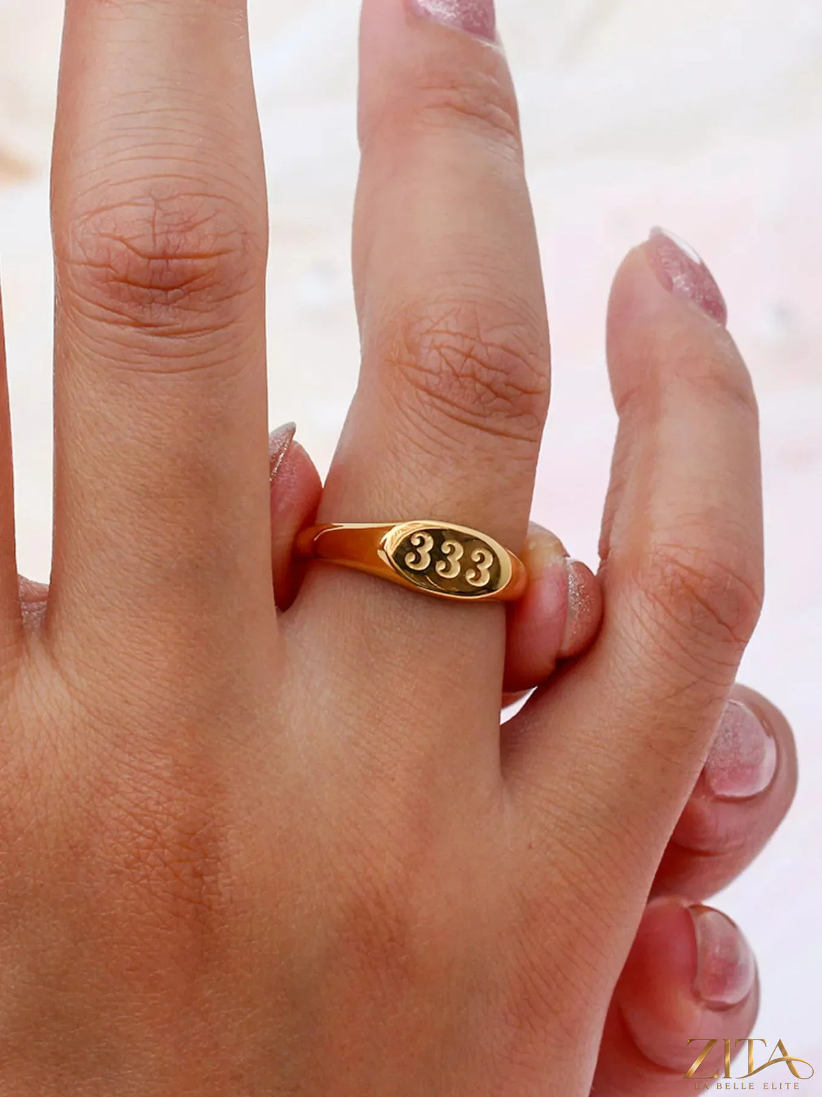 18K gold-plated 333 number signet ring by Zita La Belle Elite, featuring a sleek design and bold number engraving.
