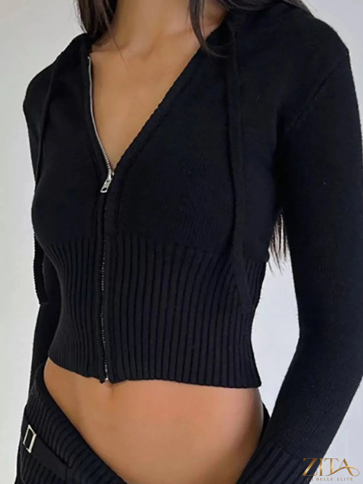 Zita La Belle Elite zip-up hooded cardigan and matching pants sweater set on a hanger, showing front view in neutral tones.