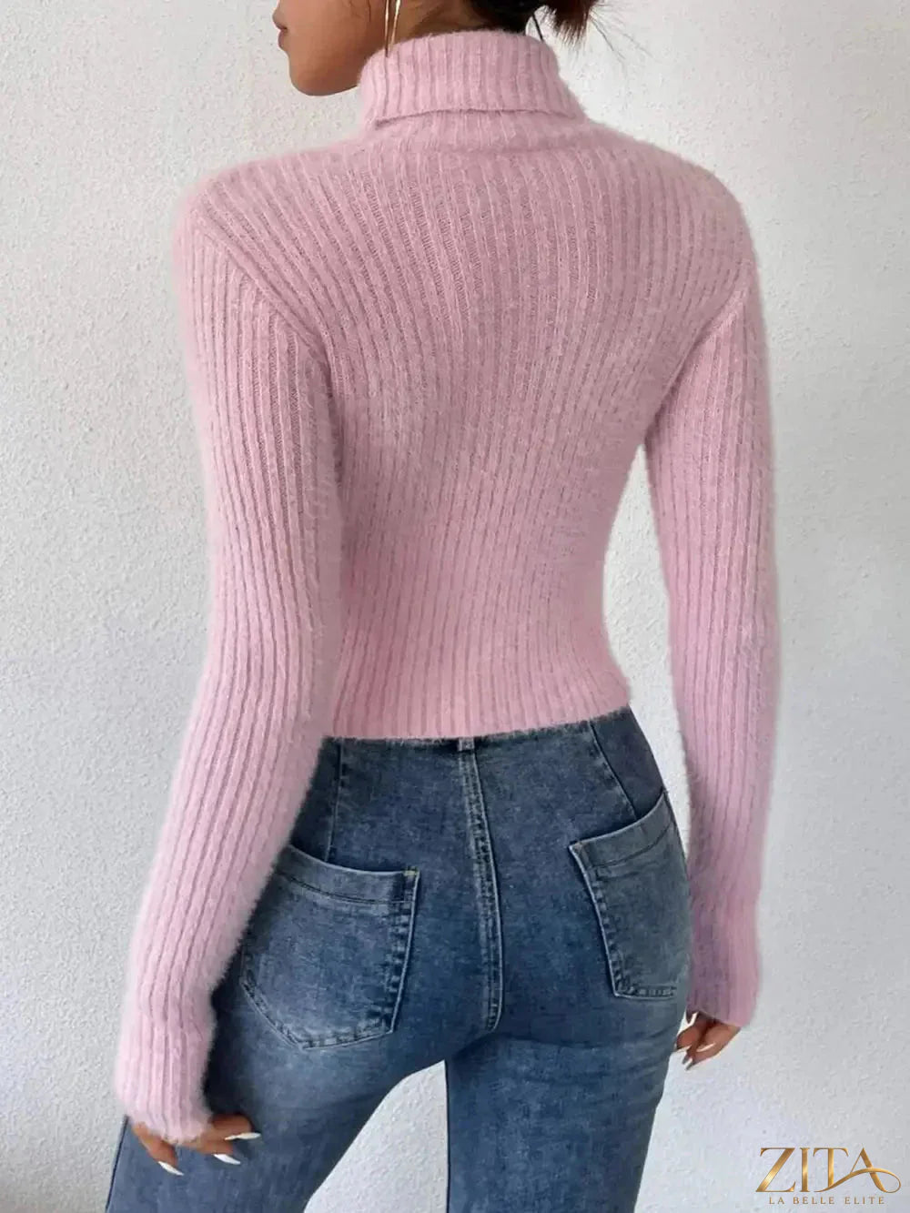 Ribbed turtleneck long sleeve sweater by Trendsi, in neutral color, displayed on a hanger.