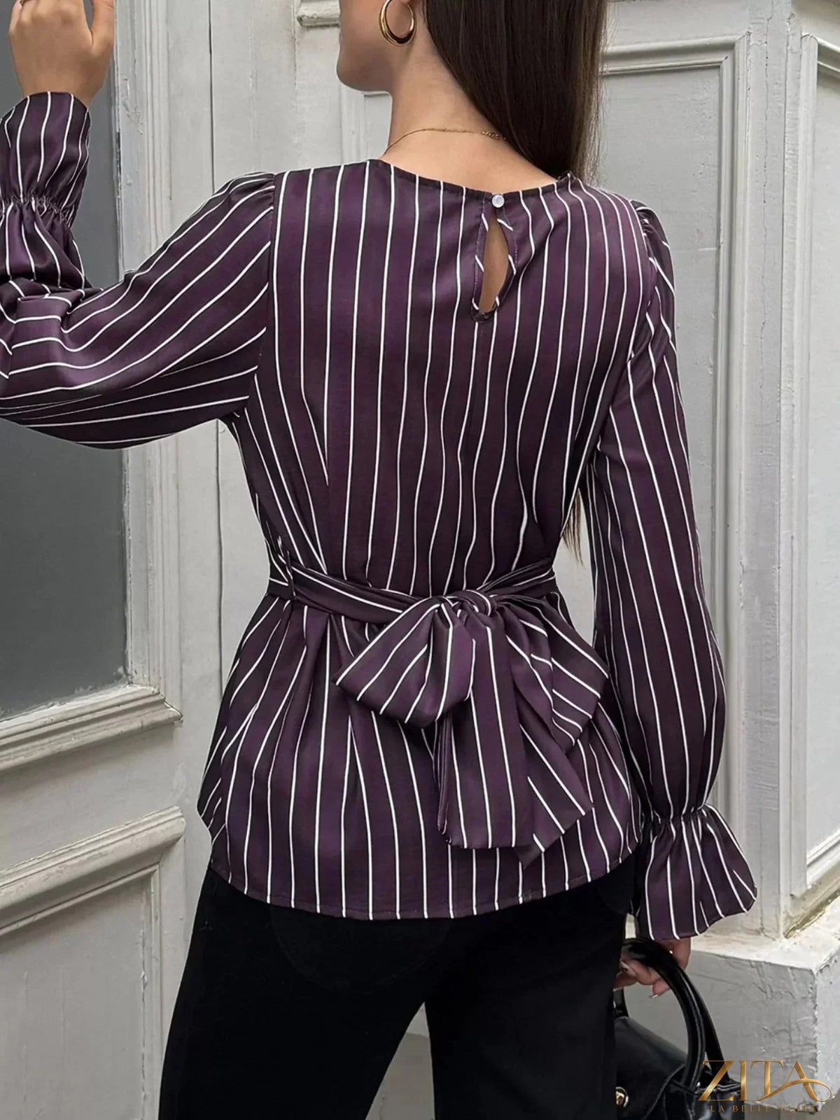 Zita La Belle Elite striped blouse with flounce sleeves, featuring a stylish design and vibrant pattern.