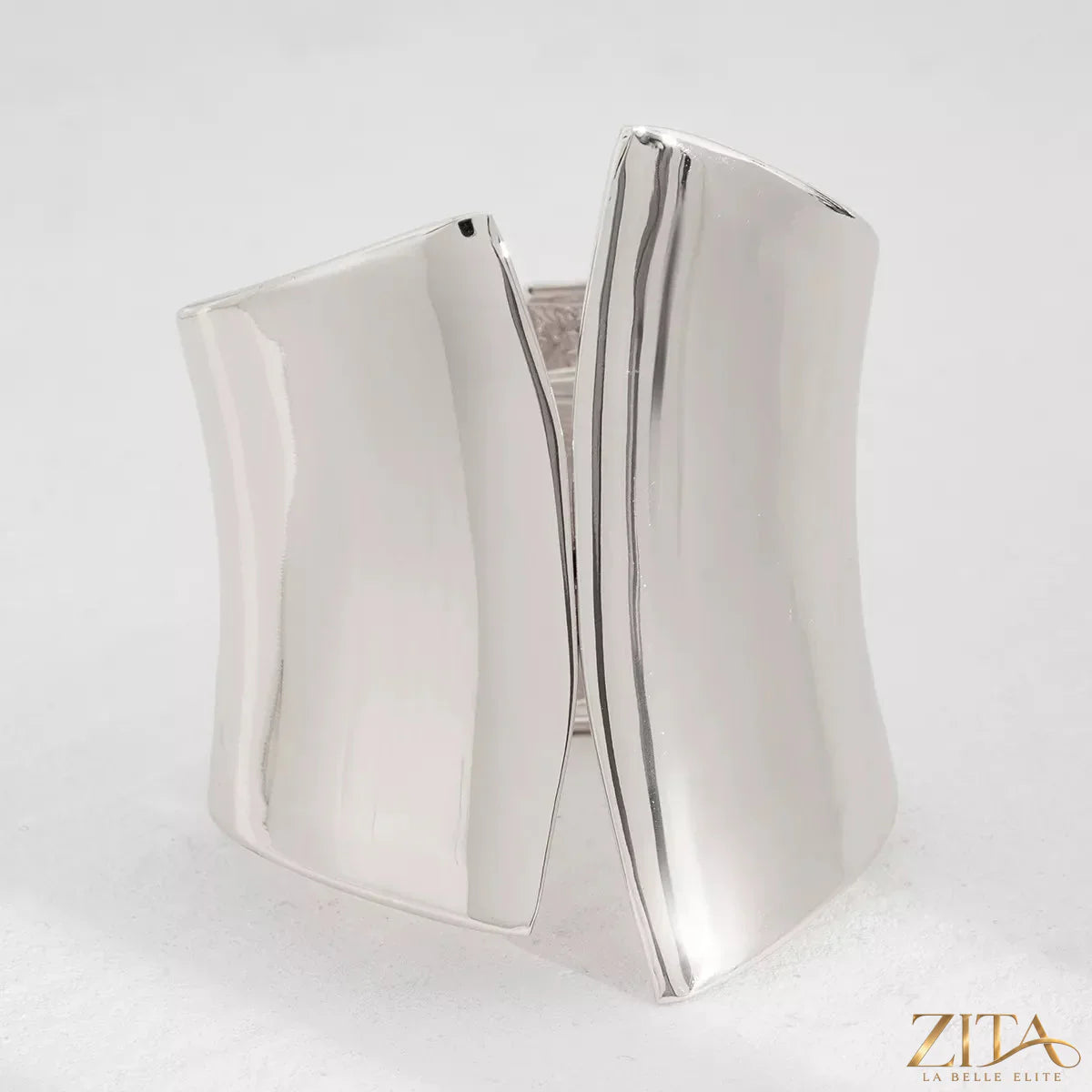 Zita La Belle Elite wide cuff bracelet with smooth metallic finish and minimalist design, worn on a wrist.