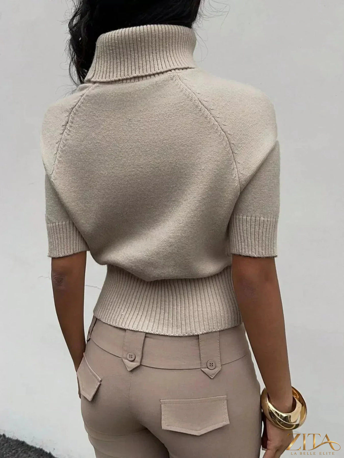 Trendsi cropped turtleneck sweater with short sleeves in a fitted style, showcasing soft knit fabric and stylish design.