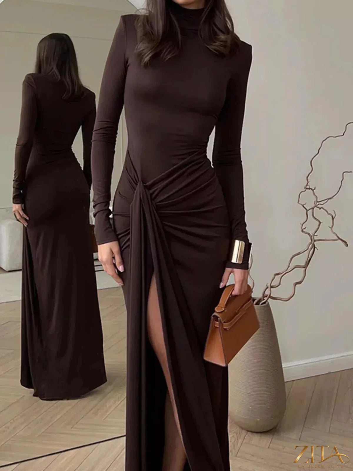 Black turtleneck long sleeve slit maxi dress by Trendsi, featuring a fitted bodice and flowing skirt, perfect for elegant occasions.