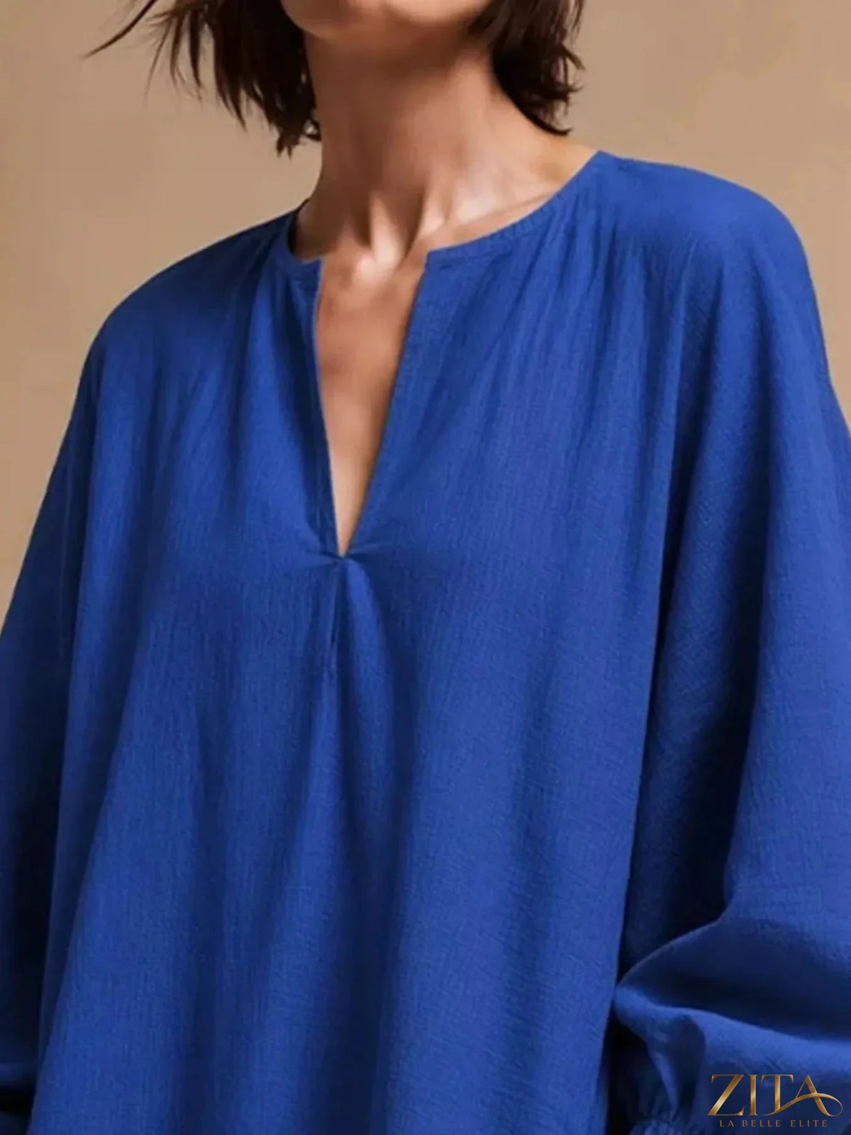 Zita La Belle Elite casual mini dress with loose fit, balloon sleeves, and pockets, styled for a relaxed, chic look.