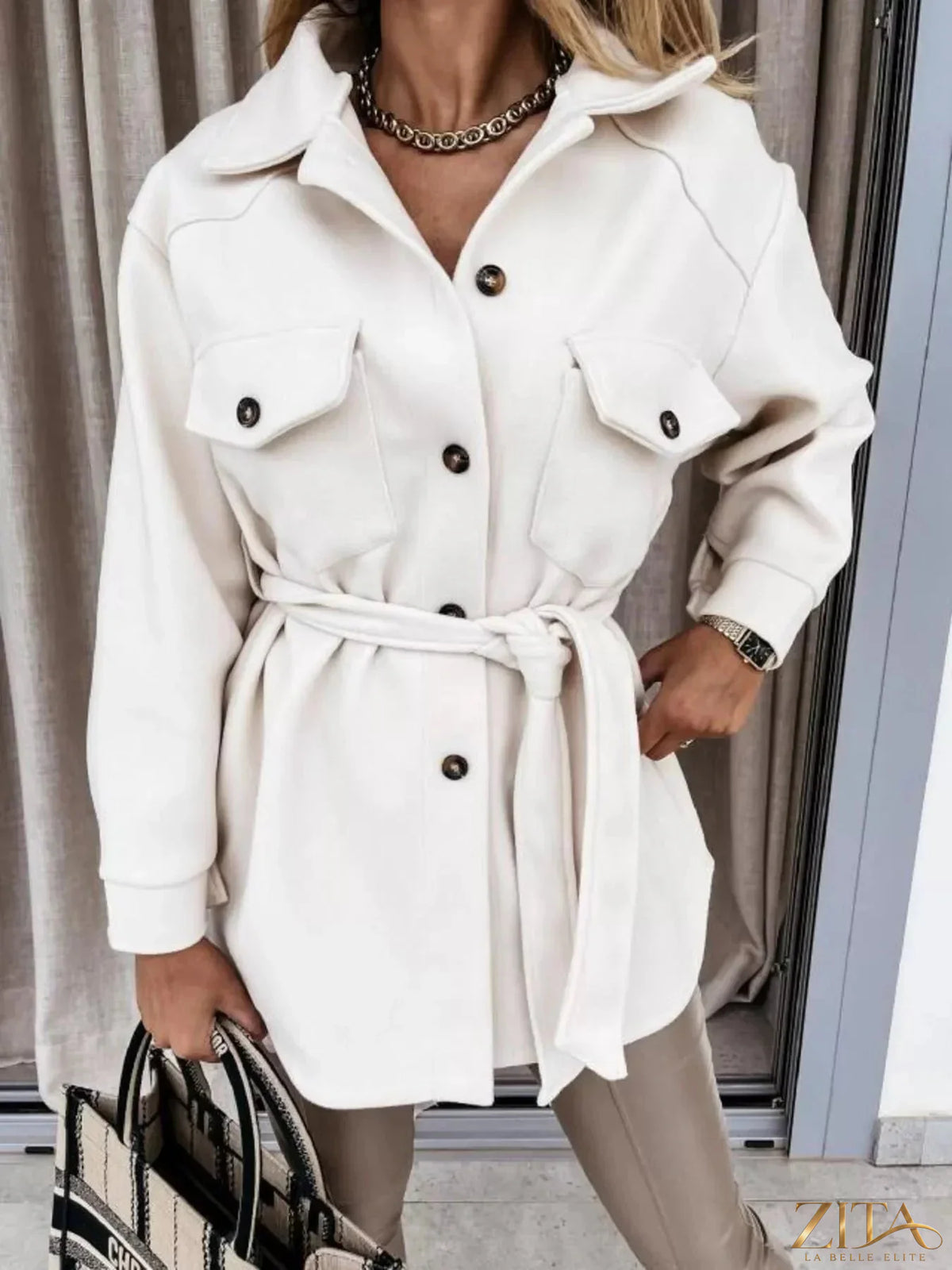 Zita La Belle Elite button-down tie waist coat in neutral fabric, featuring a collar, long sleeves, and front buttons.
