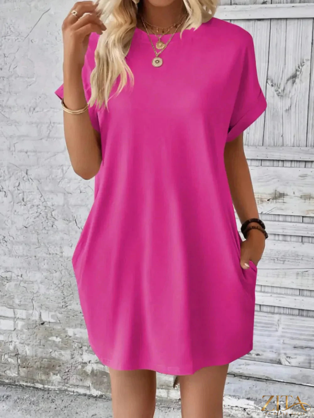 Red round neck short sleeve mini tee dress with pockets, casual fashion by Trendsi, shown on a model.