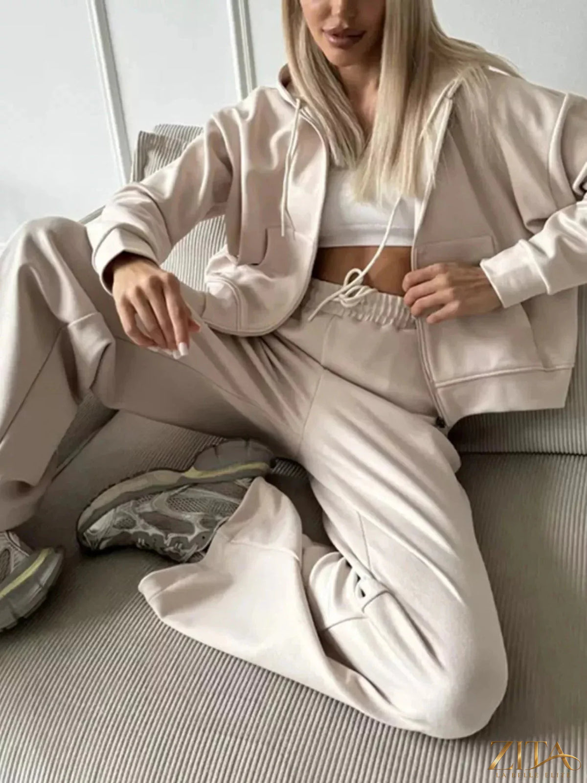 Zita La Belle Elite zip-up hoodie and wide-leg pants set in soft fabric, shown on a model with the hoodie partially unzipped.