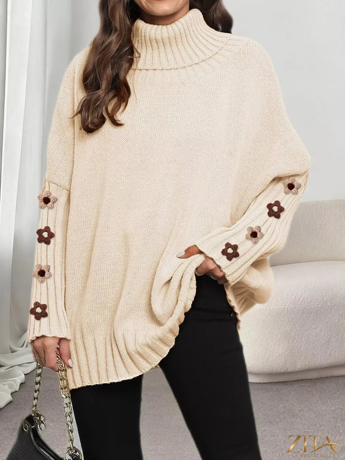 Zita La Belle Elite oversized turtleneck sweater with floral applique sleeves, cozy knit design and stylish floral details.