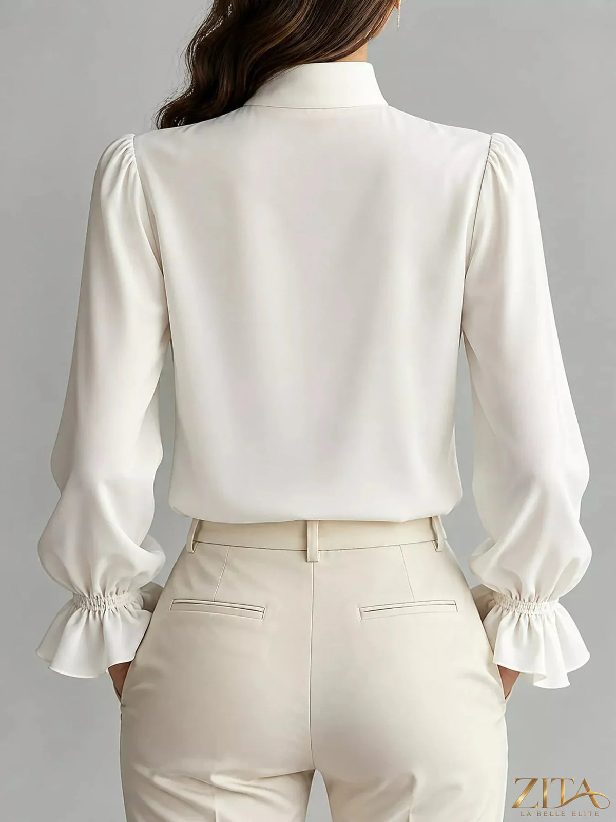 Zita La Belle Elite ruffled stand-collar blouse with long lantern sleeves, elegant and feminine, shown on a model.